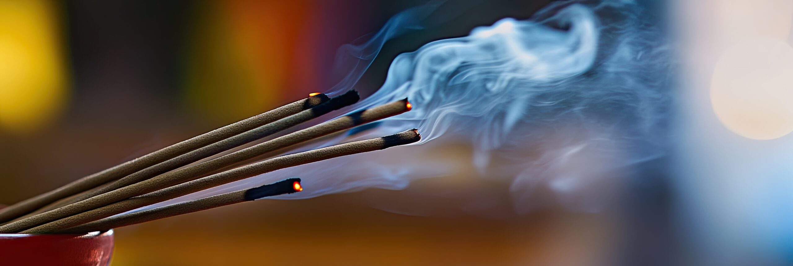 smoke coming out of incense sticks